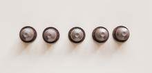 Small2_set-of-capsules-for-espresso-machine-on-white-background-4226874