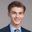 Bootstrap_a-young-man-in-a-suit-and-tie-smiling-free-photo