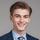 Thumb_a-young-man-in-a-suit-and-tie-smiling-free-photo