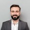 Small_imgi_13_close-up-portrait-young-bearded-man-white-shirt-jacket-posing-camera-with-broad-smile-isolated-gray_171337-629